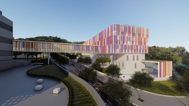 A rendering of a large, multicolored building connected by a walkway to another